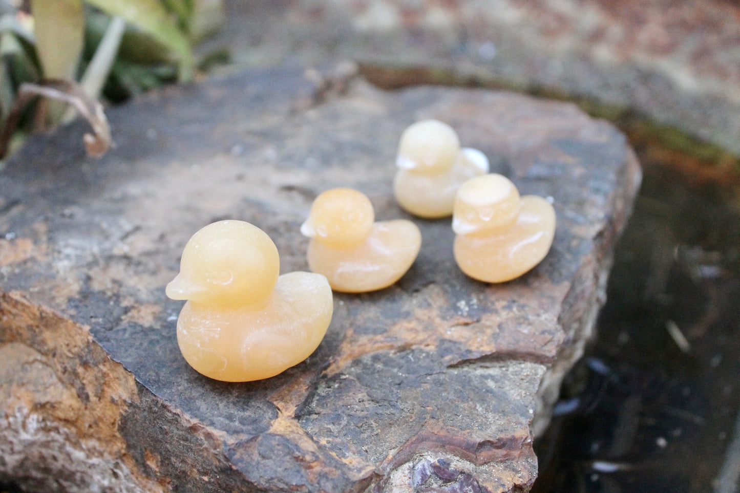 Orange calcite crystal ducks